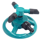 Garden sprinkler in use on a garden bed